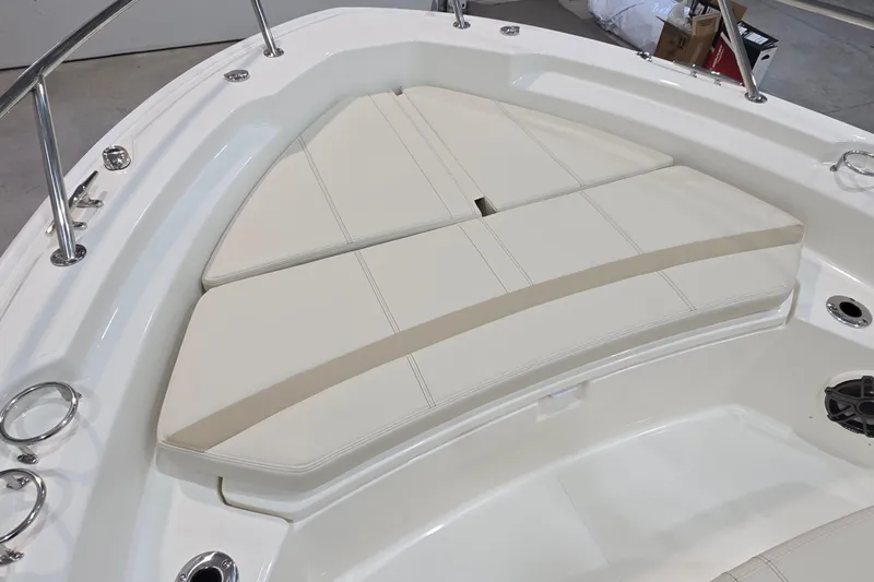 Slide: The Image of 2026 Boston Whaler 220 Dauntless boat with cushioned bow seating area. - 43