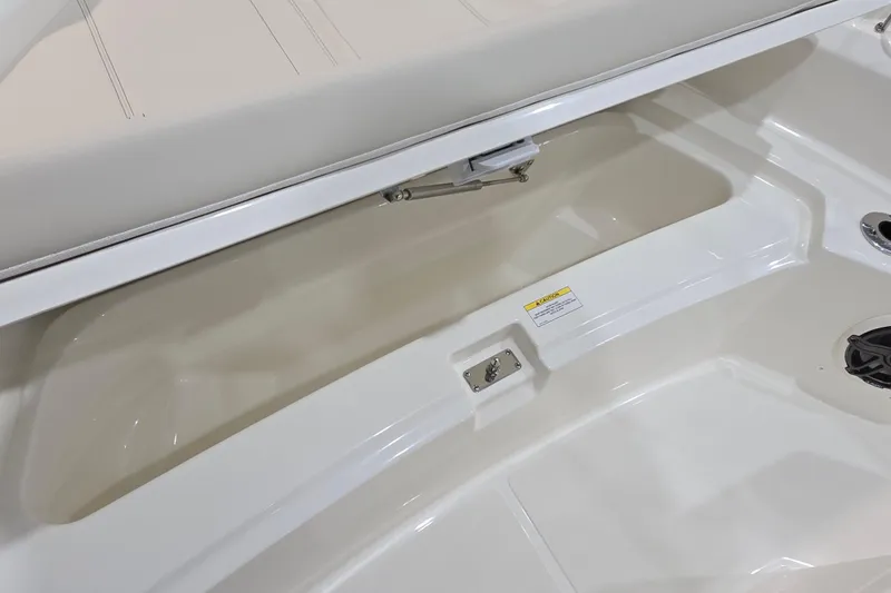 Slide: The Image of 2026 Boston Whaler 220 Dauntless boat interior storage compartment detail. - 44
