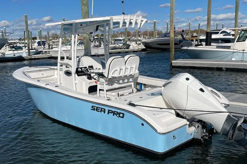 The Image of 2026 Sailfish 272 CC boat docked at marina with other luxury vessels. - 0