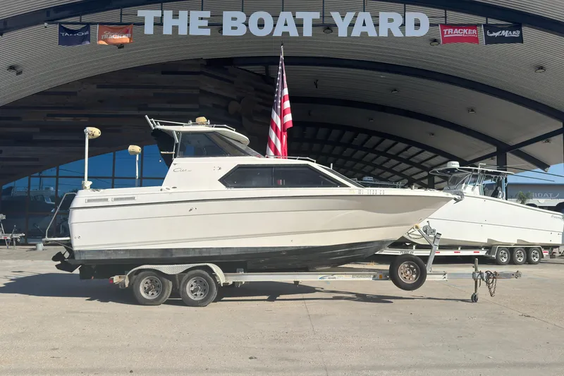 Slide: The Image of 1998 Bayliner 2452 Ciera Express boat on trailer at The Boat Yard. - 24
