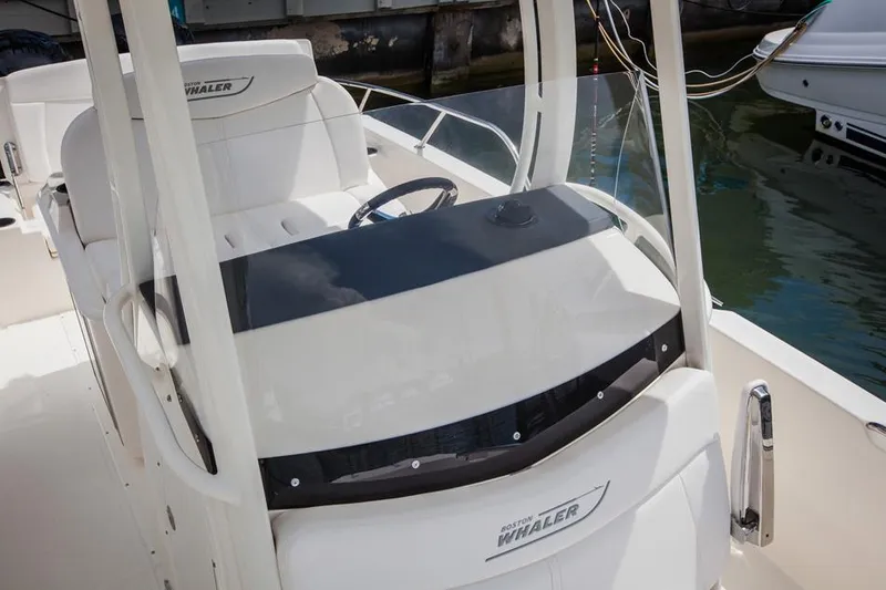 Slide: The Image of Manufacturer Provided Image: 2014 Boston Whaler 270 Dauntless boat console and seating area. - 10