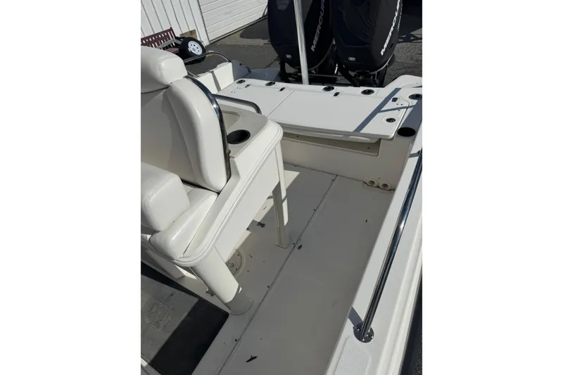 Slide: The Image of 2014 Boston Whaler 270 Dauntless boat interior with seating and storage area. - 14