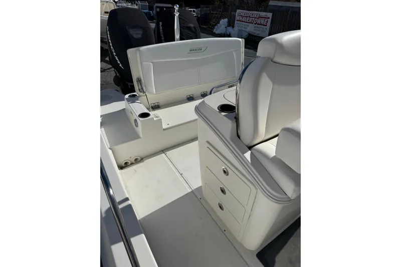 Slide: The Image of 2014 Boston Whaler 270 Dauntless boat interior with seating and storage compartments. - 15