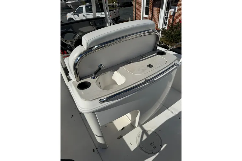 Slide: The Image of 2014 Boston Whaler 270 Dauntless boat interior with sink and storage area. - 19