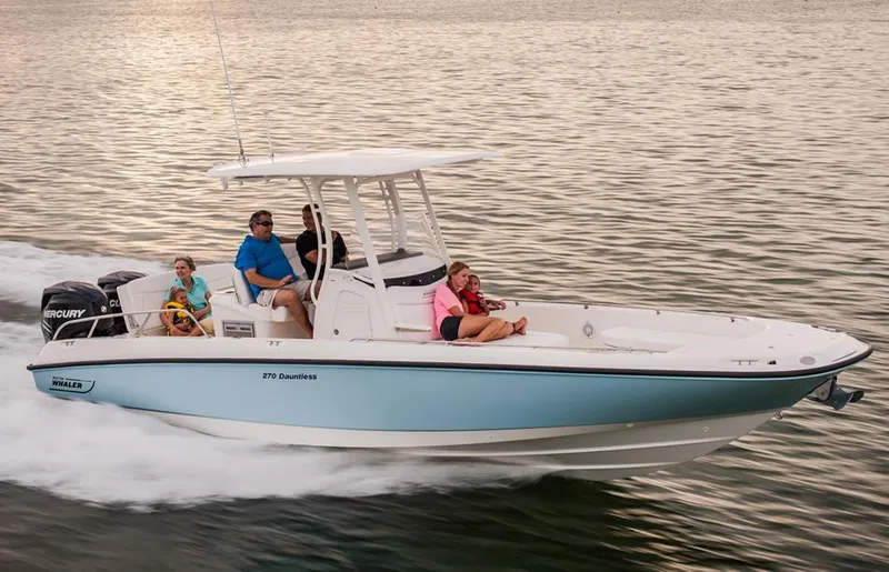 Slide: The Image of Manufacturer Provided Image: 2014 Boston Whaler 270 Dauntless boat cruising with passengers on calm water. - 2