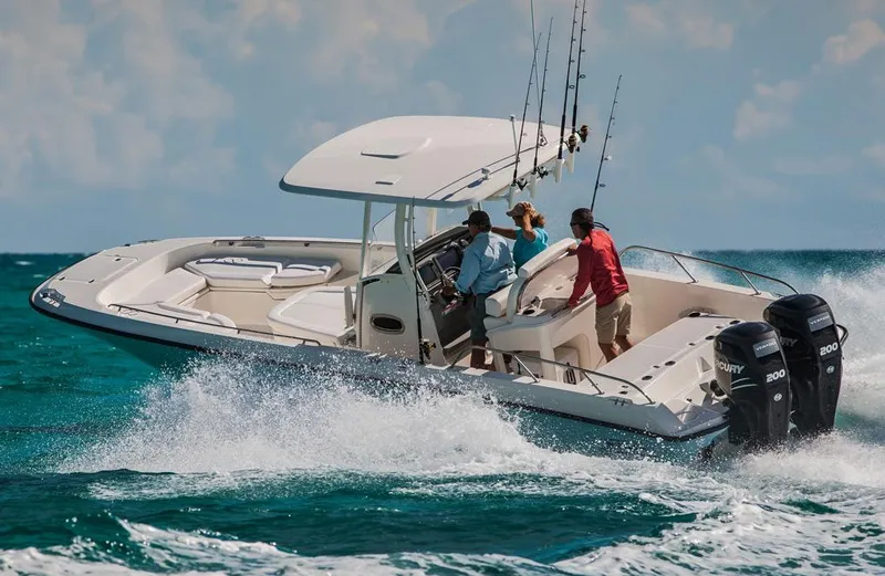Slide: The Image of Manufacturer Provided Image: 2014 Boston Whaler 270 Dauntless cruising on the ocean with three passengers. - 5