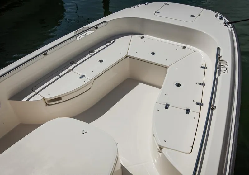 Slide: The Image of Manufacturer Provided Image: 2014 Boston Whaler 270 Dauntless boat interior with spacious seating and storage compartments. - 8