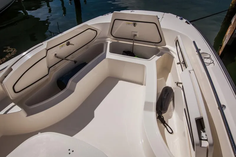 Slide: The Image of Manufacturer Provided Image: 2014 Boston Whaler 270 Dauntless boat interior with open storage compartments. - 9