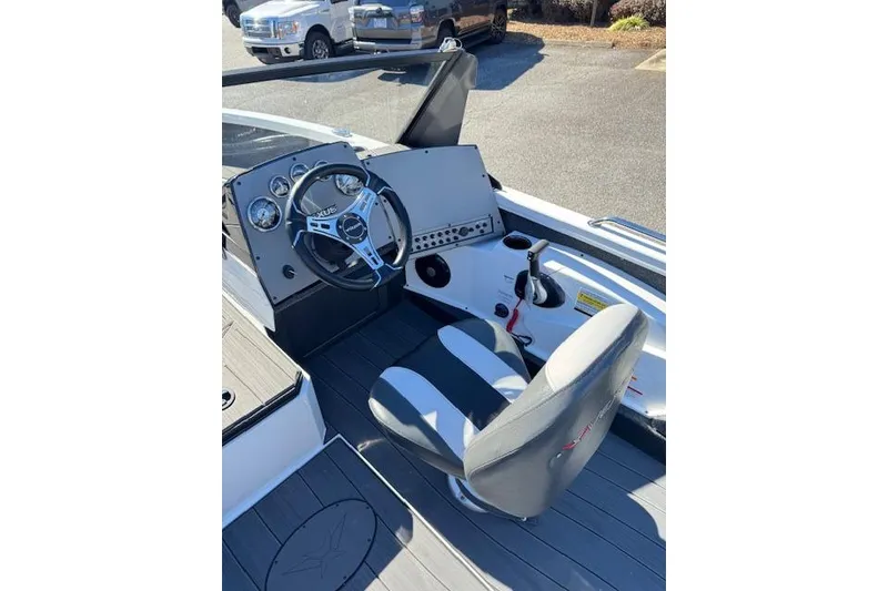 Slide: The Image of 2026 Vexus ADX 190 boat cockpit with steering wheel and control panel. - 12