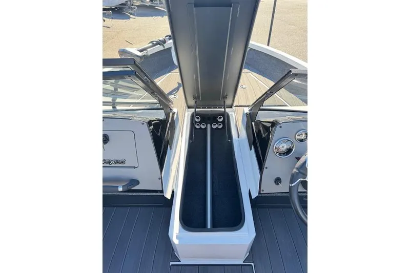 Slide: The Image of 2026 Vexus ADX 190 boat interior with open storage compartment and dashboard view. - 15