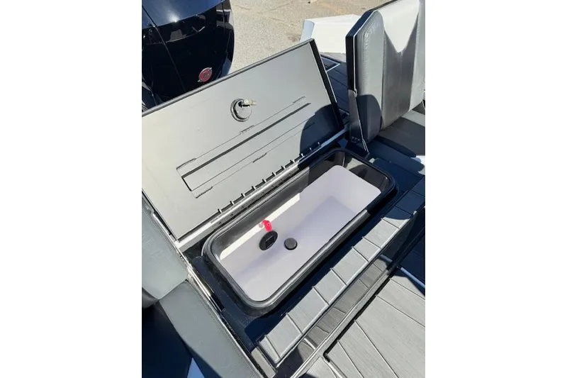 Slide: The Image of Open storage compartment in 2026 Vexus ADX 190 boat, showcasing interior design. - 16