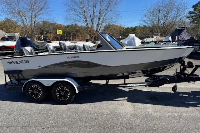 Slide: The Image of 2026 Vexus ADX 190 boat on trailer, parked outdoors, side view. - 4
