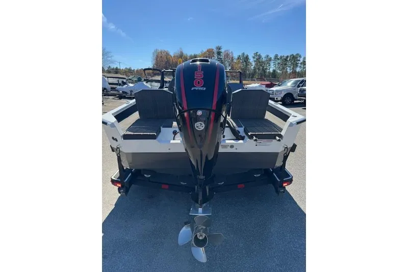 Slide: The Image of 2026 Vexus ADX 190 boat with a 150 horsepower engine, parked outdoors. - 5