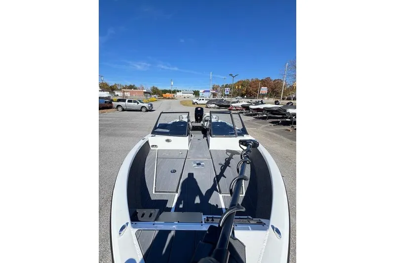 Slide: The Image of 2026 Vexus ADX 190 boat in parking lot, showcasing sleek design and modern features. - 6