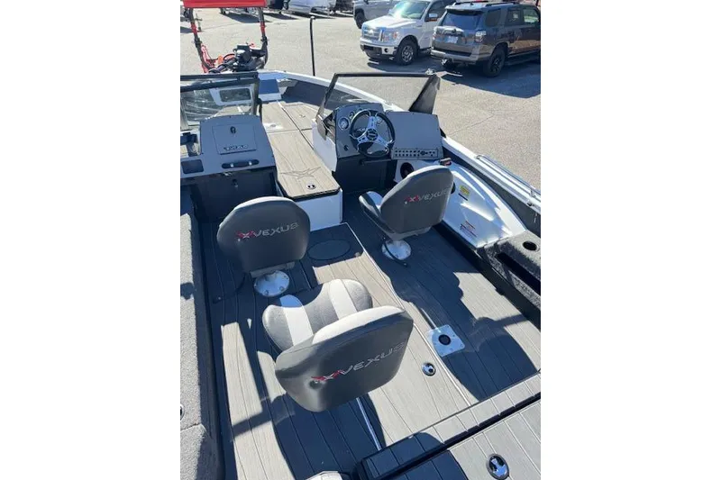 Slide: The Image of 2026 Vexus ADX 190 boat interior with steering wheel and seating. - 9