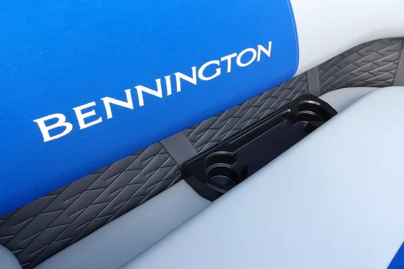 Slide: The Image of 2026 Bennington S Quad Bench 22 SSR with blue and gray seating on a boat. - 13