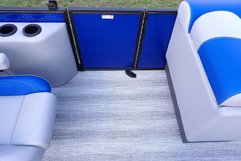 Slide: The Image of 2026 Bennington S Quad Bench 22 SSR storage compartment with blue and gray seating. - 15