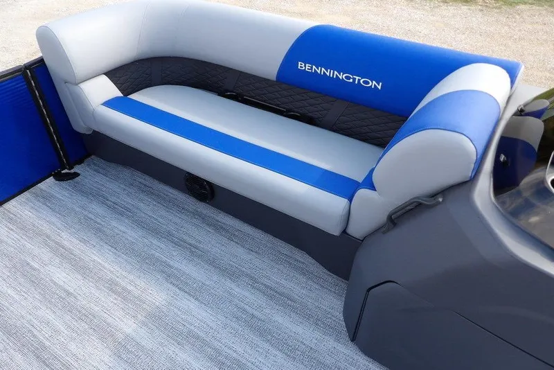Slide: The Image of 2026 Bennington S Quad Bench 22 SSR with blue and gray seating, cup holders. - 17