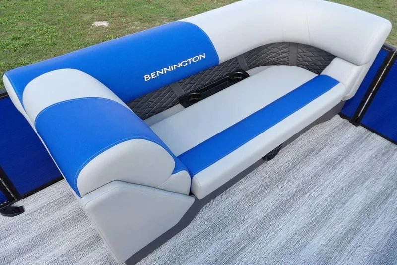 Slide: The Image of 2026 Bennington S Quad Bench 22 SSR interior with cup holders and quilted upholstery. - 18