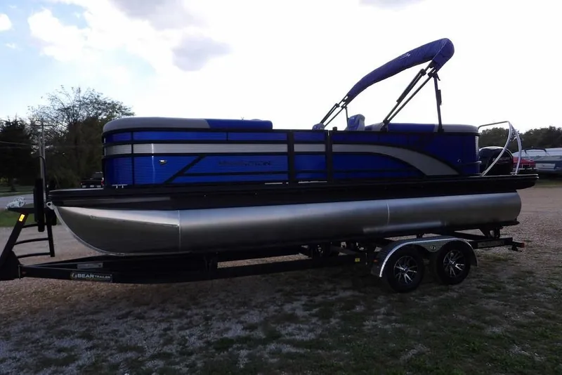 Slide: The Image of 2026 Bennington S Quad Bench 22 SSR pontoon boat on trailer, side view. - 2