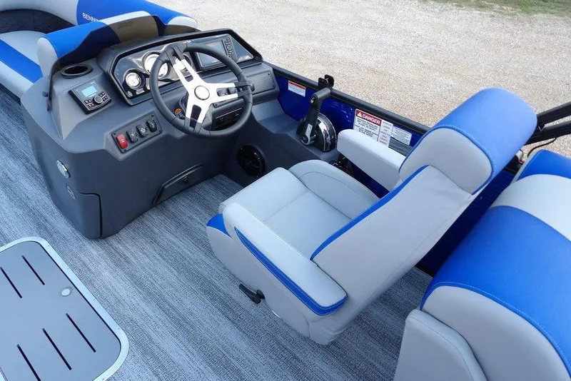 Slide: The Image of Steering console of 2026 Bennington S Quad Bench 22 SSR with modern controls and displays. - 23