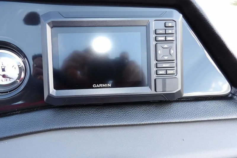 Slide: The Image of 2026 Bennington S Quad Bench 22 SSR boat interior with steering wheel and seating. - 28