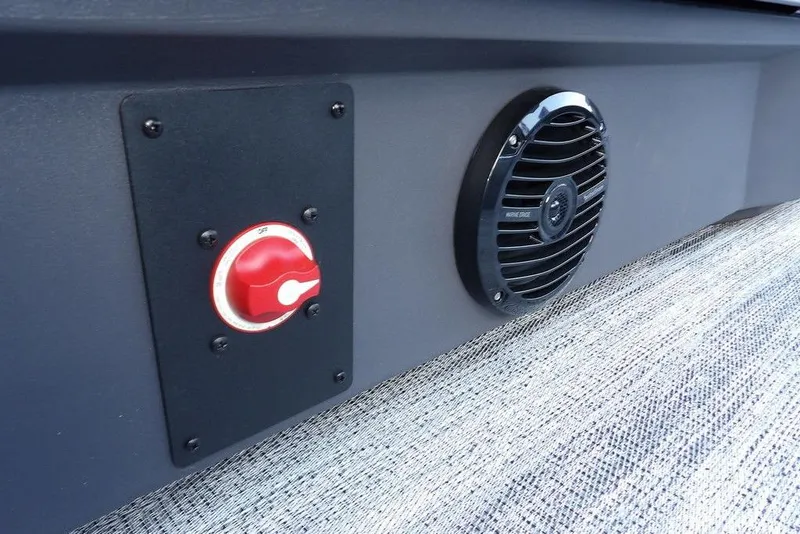 Slide: The Image of 2026 Bennington S Quad Bench 22 SSR boat interior with speaker and control switch. - 37