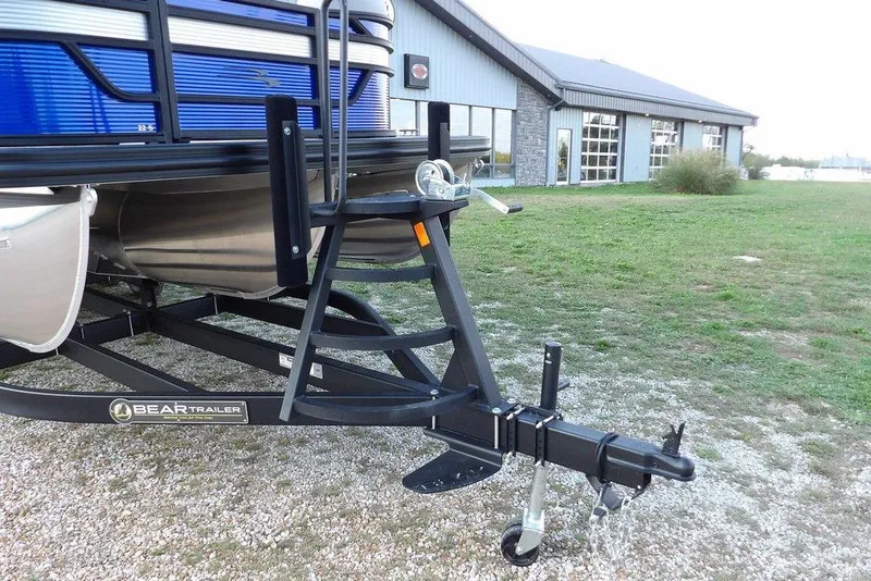 Slide: The Image of 2026 Bennington S Quad Bench 22 SSR boat deck with chrome railings and textured flooring. - 38