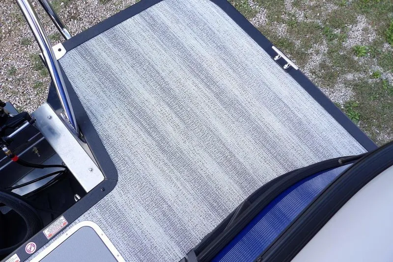 Slide: The Image of Trailer wheels of 2026 Bennington S Quad Bench 22 SSR on gravel surface. - 39