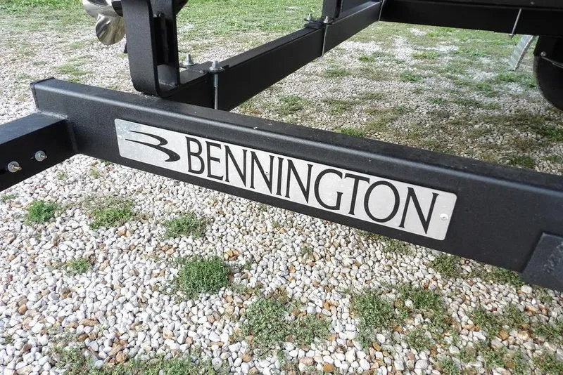 Slide: The Image of 2026 Bennington S Quad Bench 22 SSR with blue and gray seating and cup holders. - 41