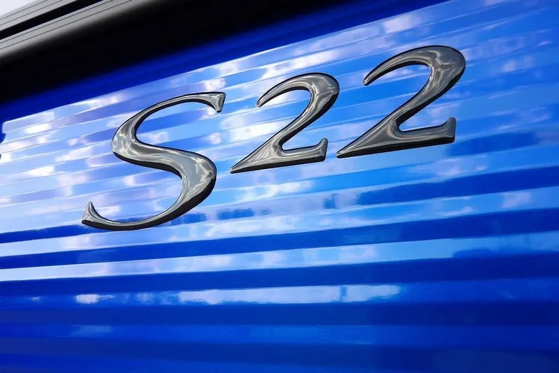 Slide: The Image of 2026 Bennington S Quad Bench 22 SSR, blue exterior with S22 emblem. - 47