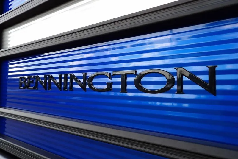 Slide: The Image of Bennington logo on blue panel of 2026 S Quad Bench 22 SSR boat. - 48