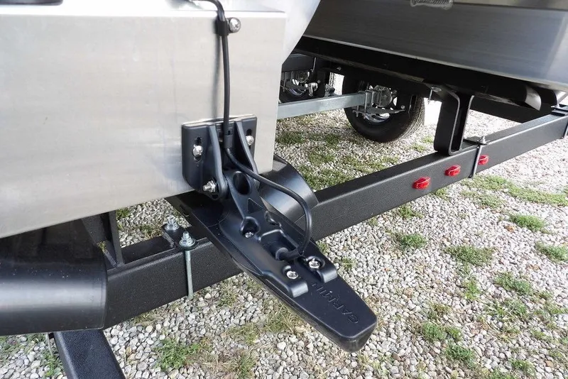 Slide: The Image of 2026 Bennington S Quad Bench 22 SSR pontoon boat with Mercury engine and trailer. - 53