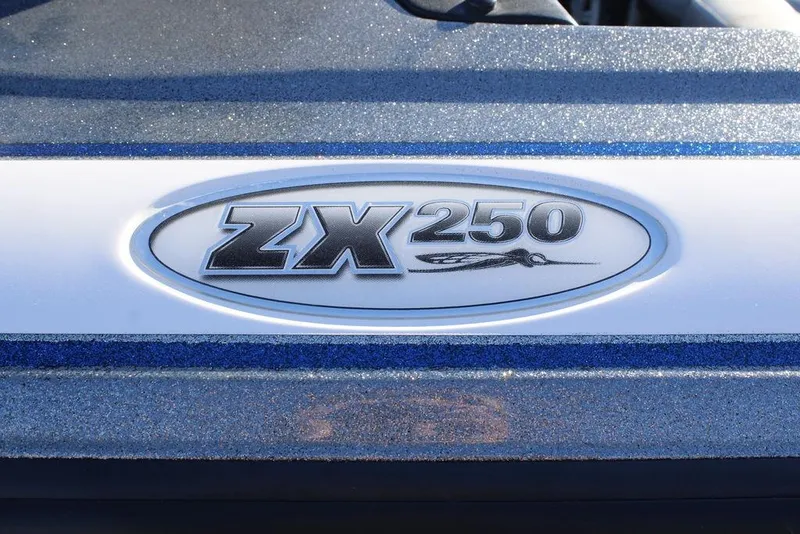 Slide: The Image of 2003 Skeeter ZX250 logo on a metallic blue surface. - 4
