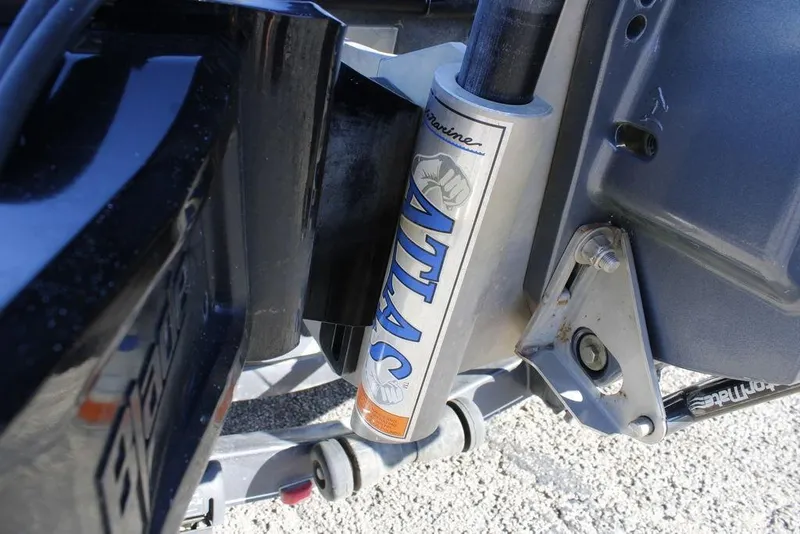 Slide: The Image of Close-up of a 2003 Skeeter ZX250 boat's Atlas hydraulic jack plate. - 6