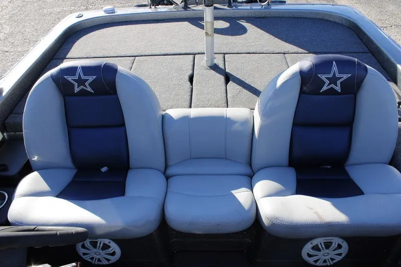 Slide: The Image of 2003 Skeeter ZX250 boat seats with star design, featuring gray and navy upholstery. - 8