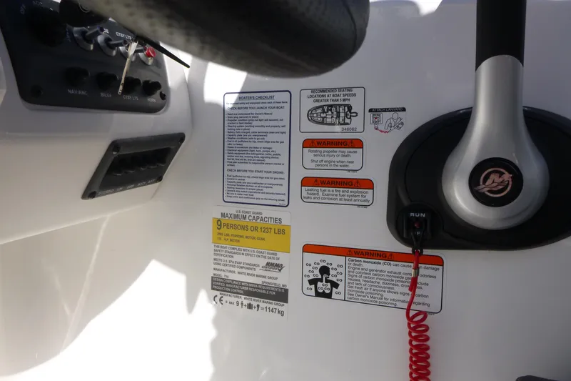 Slide: The Image of 2024 Tahoe T18 boat dashboard with safety warnings and capacity details. - 17