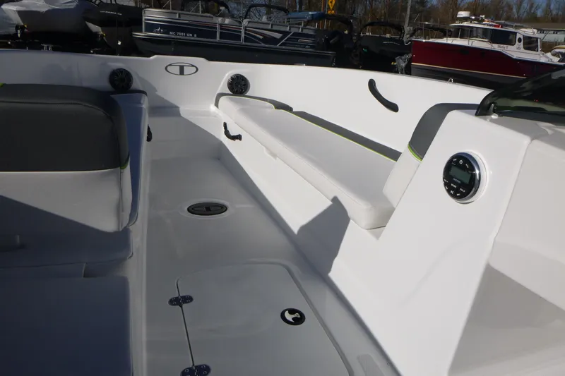 Slide: The Image of 2024 Tahoe T18 boat interior with seating and control panel, showcasing modern design. - 18