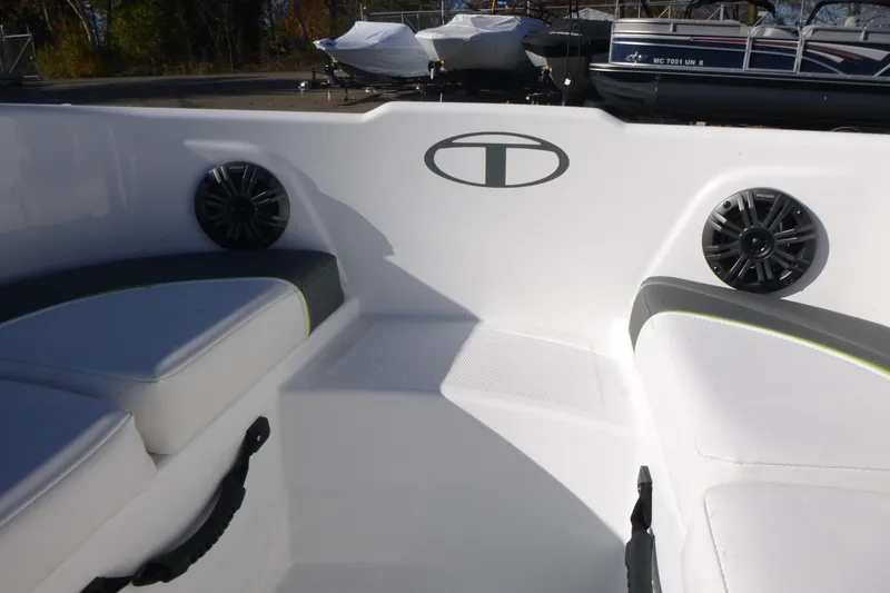 Slide: The Image of 2024 Tahoe T18 boat interior with cushioned seating and speakers. - 21