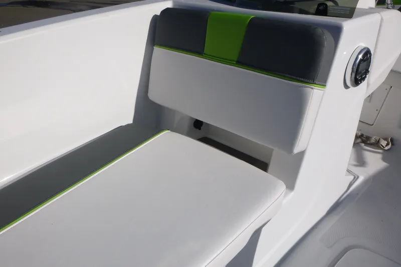 Slide: The Image of 2024 Tahoe T18 boat seat with white and green accents, modern design. - 22