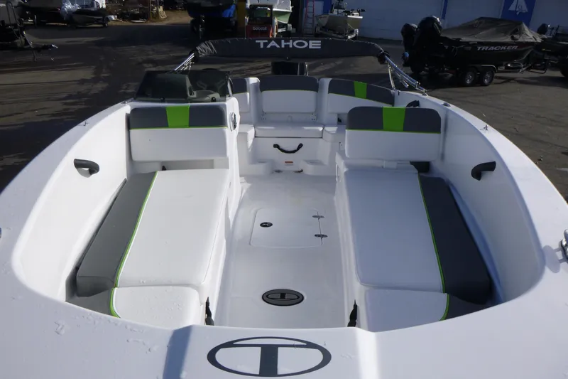 Slide: The Image of 2024 Tahoe T18 boat interior with white and green seating, spacious layout. - 25