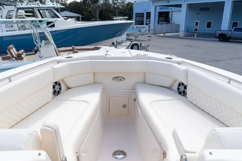 Slide: The Image of 2024 Grady-White Freedom 307 boat interior with white seating and modern design. - 14