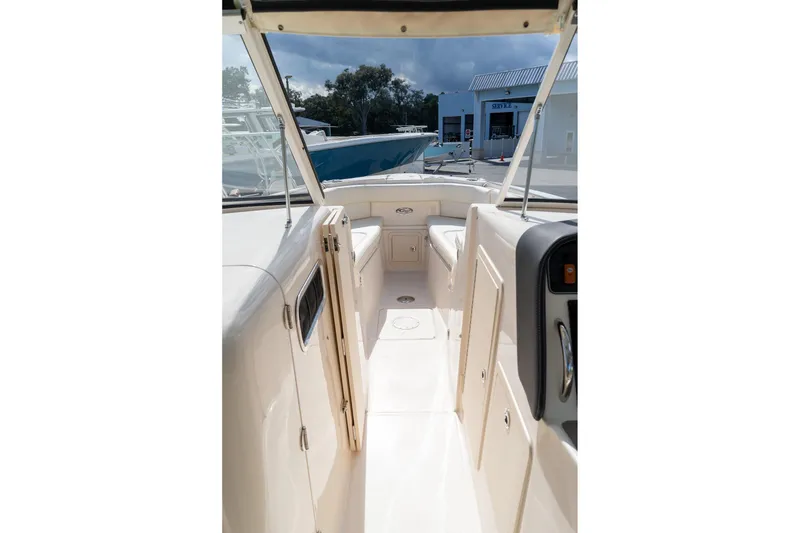 Slide: The Image of 2024 Grady-White Freedom 307 boat interior, featuring spacious seating and modern design. - 25