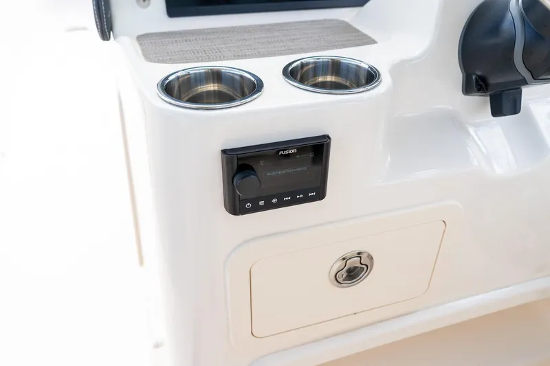 Slide: The Image of 2024 Grady-White Freedom 307 boat console with cup holders and Fusion audio system. - 34