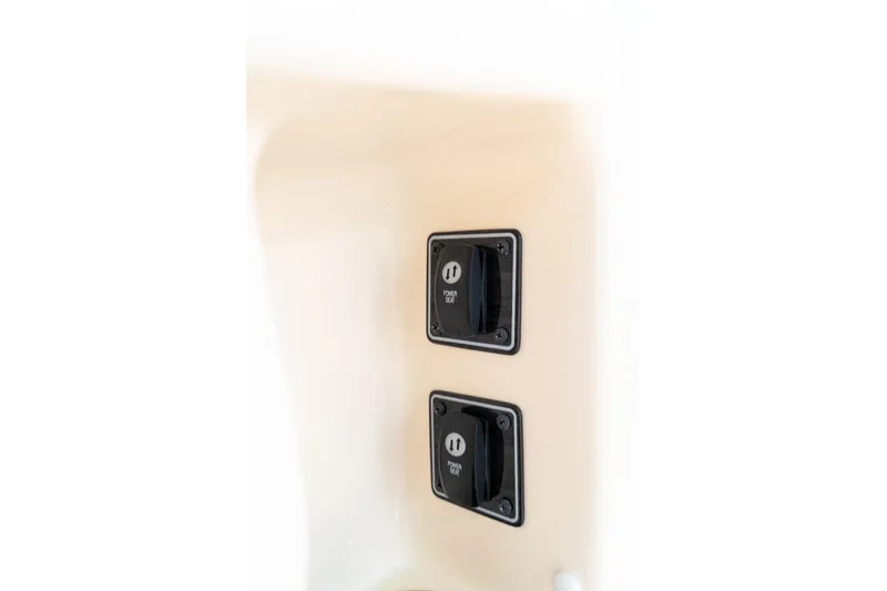 Slide: The Image of 2024 Grady-White Freedom 307 boat switches on beige panel. - 35