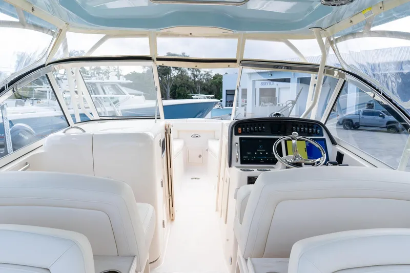 Slide: The Image of 2024 Grady-White Freedom 307 boat interior with modern dashboard and seating. - 44