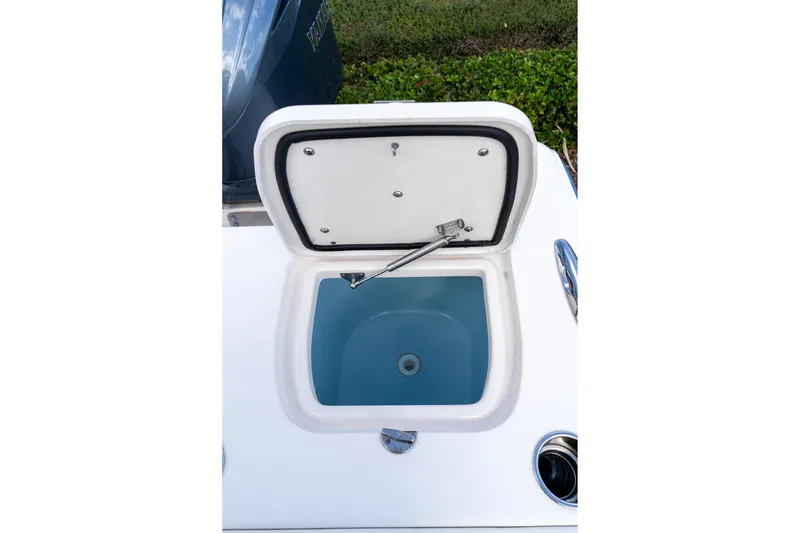Slide: The Image of Open storage compartment on 2024 Grady-White Freedom 307 boat. - 50