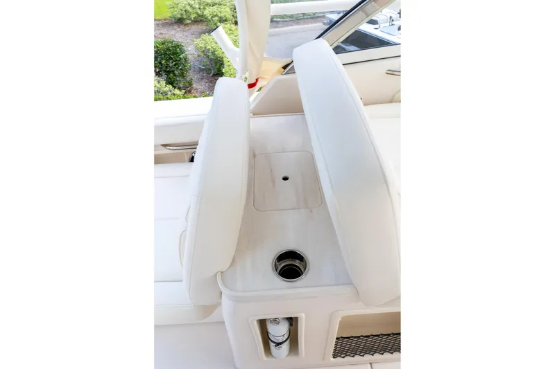 Slide: The Image of 2024 Grady-White Freedom 307 boat interior seating and cup holder detail. - 53