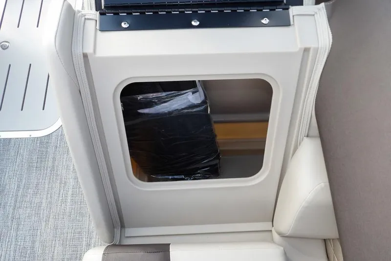 Slide: The Image of 2026 Bennington S Swingback 22 SSB storage compartment with sleek interior design. - 13
