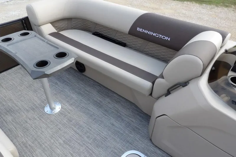 Slide: The Image of 2026 Bennington S Swingback 22 SSB boat interior with seating and cup holders. - 14